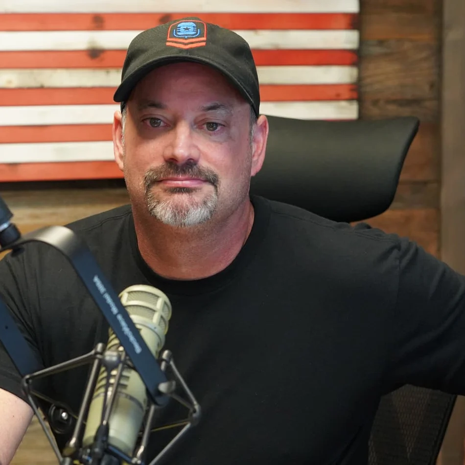 Ed Parcaut, U.S. Navy veteran and founder of Helping The Brave, at the studio microphone
